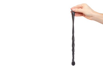 Teenager playing black slime with hand, transparent toy