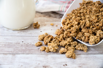 healthy breakfast. bowl with cereals and milk on wooden background