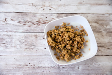 healthy breakfast. bowl with cereals on wooden background with copy space
