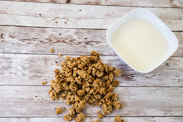 healthy breakfast. bowl with cereals and milk on wooden background