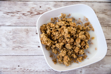 healthy breakfast. bowl with cereals on wooden background with copy space