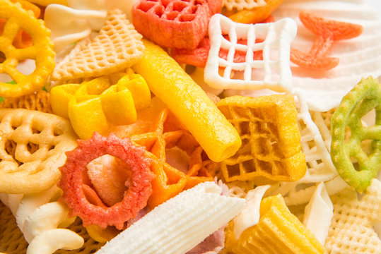 Snack pellets are non-expanded products made with raw materials like cereals, potatoes or vegetable powders, later processed using frying, hot air baking. multicoloured / shaped ready-to-eat snacks