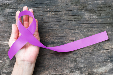 Orchid ribbon awareness symbolic concept for raising support people life living with Testicular...