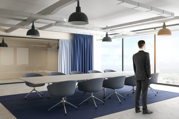 Businessman in contemporary meeting room