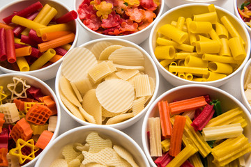 Snack pellets are non-expanded products made with raw materials like cereals, potatoes or vegetable powders, later processed using frying, hot air baking. multicoloured / shaped ready-to-eat snacks