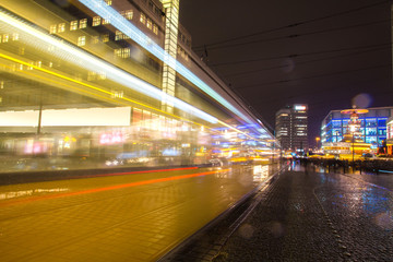 Fototapeta na wymiar alexanderplatz city night traffic lights berlin in the rain