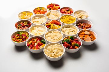 Snack pellets are non-expanded products made with raw materials like cereals, potatoes or vegetable powders, later processed using frying, hot air baking. multicoloured / shaped ready-to-eat snacks