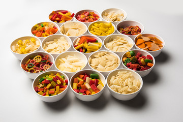 Snack pellets are non-expanded products made with raw materials like cereals, potatoes or vegetable powders, later processed using frying, hot air baking. multicoloured / shaped ready-to-eat snacks