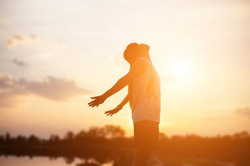 strong confidence woman open arms under the sunset.