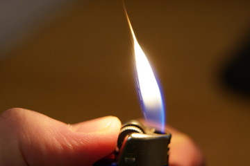 Flame macro, lighter ignition, thumb