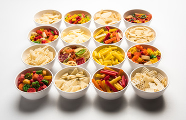 Snack pellets are non-expanded products made with raw materials like cereals, potatoes or vegetable powders, later processed using frying, hot air baking. multicoloured / shaped ready-to-eat snacks