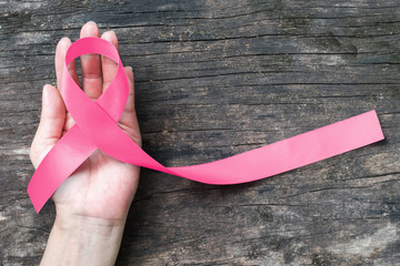 Breast cancer pink awareness ribbon symbolic bow color raising support campaign on people living...