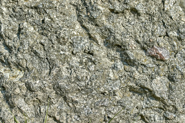 the textured stone surface or gray background