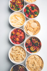 Snack pellets are non-expanded products made with raw materials like cereals, potatoes or vegetable powders, later processed using frying, hot air baking. multicoloured / shaped ready-to-eat snacks