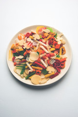Snack pellets are non-expanded products made with raw materials like cereals, potatoes or vegetable powders, later processed using frying, hot air baking. multicoloured / shaped ready-to-eat snacks