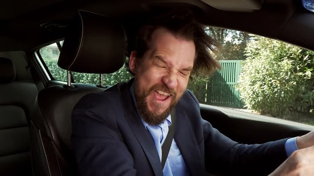 Angry man screaming while driving suv car slow motion