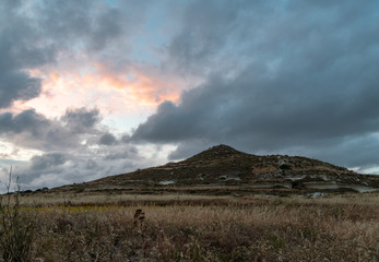 Tick clouds masking the colourful sunset