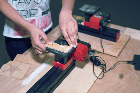 Children learn to make custom objects in fablab classes. Joiner's training on makerfaire.