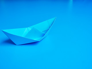 Business origami blue boat paper