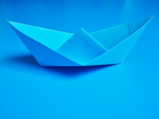 Business origami blue boat paper