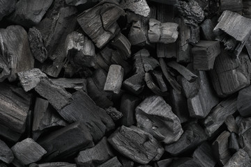 Black charcoal texture background. Close-up. Top view.