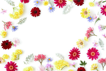 Fototapeta na wymiar Floral pattern with spring flowers and leaves on white background with copy space. Flat lay. Top view