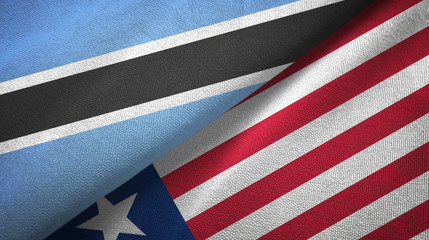 Fototapeta premium Botswana and Liberia two flags textile cloth, fabric texture