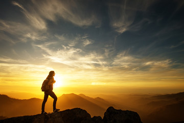 Fototapeta premium Hiker meets the sunset on the Moro rock in Sequoia national park, California, USA.