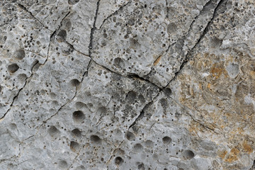 old rough, weathered, textured rock surface