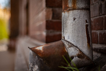 close up of the drain pipe on the wall