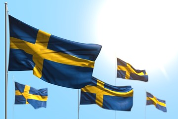 beautiful national holiday flag 3d illustration. - 5 flags of Sweden are wave against blue sky picture with selective focus