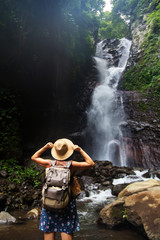 Fototapeta premium Woman near waterfal on Bali, Indonesia&nbsp;