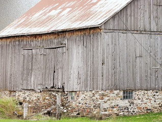 Old and weathered country barn with abstract background