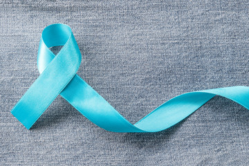 Blue ribbon symbolic of prostate cancer awareness campaign and men's health in November month on...