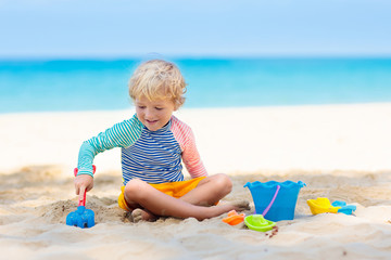Kids playing on beach. Children play at sea.
