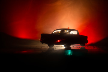 Obraz na płótnie Canvas Police cars at night. Police car chasing a car at night with fog background. 911 Emergency response