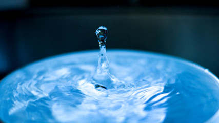 falling drop into clear water