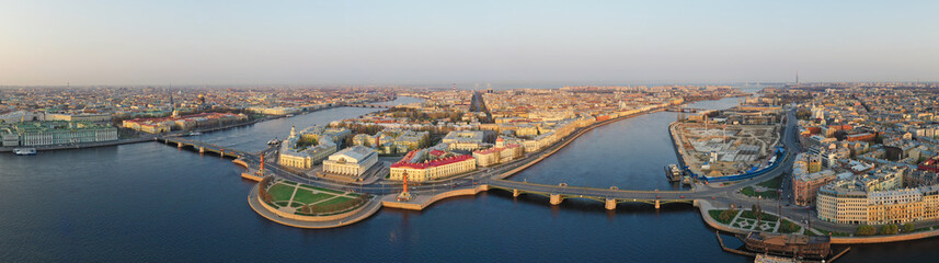 Fototapeta na wymiar Panorama of the spit of Vasilyevsky island, Palace Square, the Hermitage, Peter and Paul Fortress and Petrograd Island.. Aerial view. The Neva river, St. Petersburg, Russia