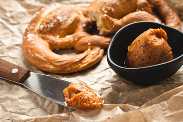 Fresh Bavarian Pretzel with Homemade Mangalica Fat Spread. Traditional Cuisine.