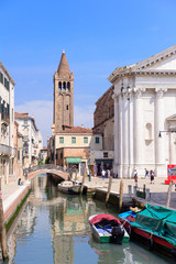 Fototapeta na wymiar VENICE, ITALY - MAY, 2017: Canal with bridges in the heart of Venice