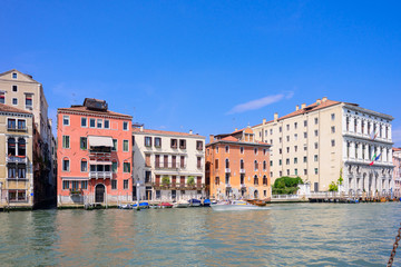 Fototapeta na wymiar VENICE, ITALY - MAY, 2017: Venice houses facades and the grand canal in a sunny day in Italy