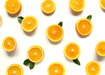 Fototapeta na wymiar Round orange slices on a white background. Citrus tropical fruit background. Bright food. Dietary vitamin nutrition. A lot of vitamin C.