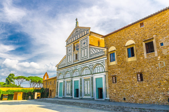 Abbazia di San Miniato al Monte basilica, Palazzo dei Vescovi (Palace of Bishops) in Parco della Rimembranza park in Florence city, blue sky white clouds, Tuscany, Italy