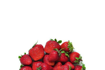 A lot of strawberry berries on a white background. A group of sweet fruits. Vitamin fruits for smoothies, cocktails and preserves. Natural products for healthy nutrition for vegetarians.