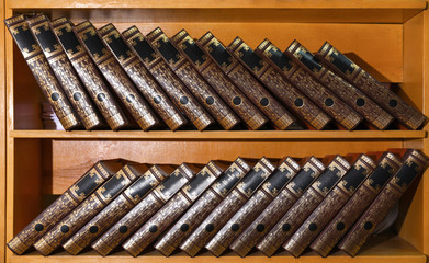 Wooden cabinets with collection of books in library