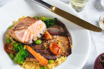 Roasted Salmon Fillet with Vegetables on Rustic White Plate. Healthy Food Concept.