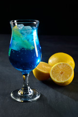 blue lagoon cocktail on dark background