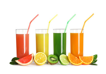 Glasses with different juices and fresh fruits on white background