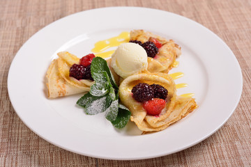 pancakes with raspberries and blackberries, ice cream concept for the restaurant menu.