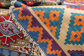 Many carpets, different colors, a great choice in the store.